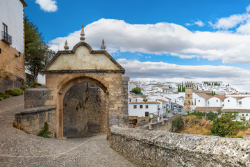 Fototapeta na wymiar View of the city and the old stone gate. Ronda, Spain, Andalusia..