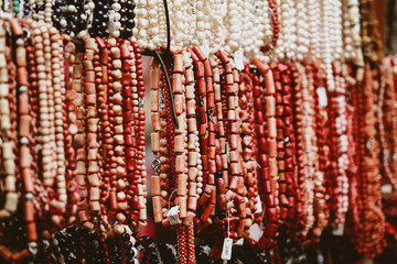 collection of multi-colored beads at a street fair