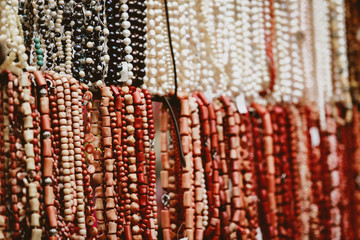 collection of multi-colored beads at a street fair