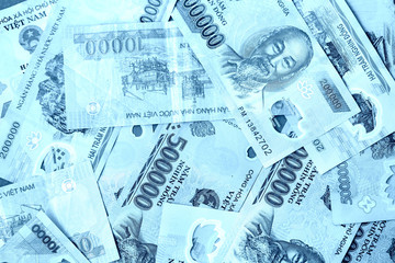 Vietnamese dong bills close up, blue color toned
