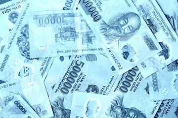 Fototapeta premium Vietnamese dong bills close up, blue color toned