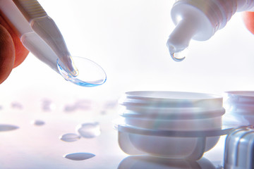 Applying liquid in contact lens case to place one