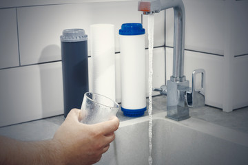 Replacing the water filter. Ecology. Clean water.