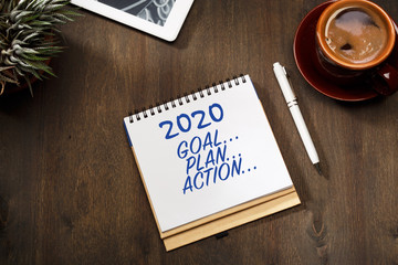 2020 new year goal, plan, action text on notepad. Business motivation, inspiration concepts