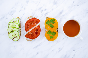 Veggan sandwiches with tea top view