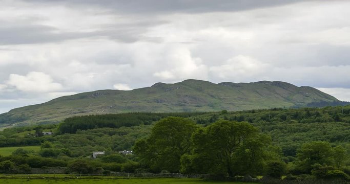 Time Lapse of green countryside landscape on a cloudy day in Ireland.