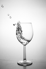 Glass with water up and splash