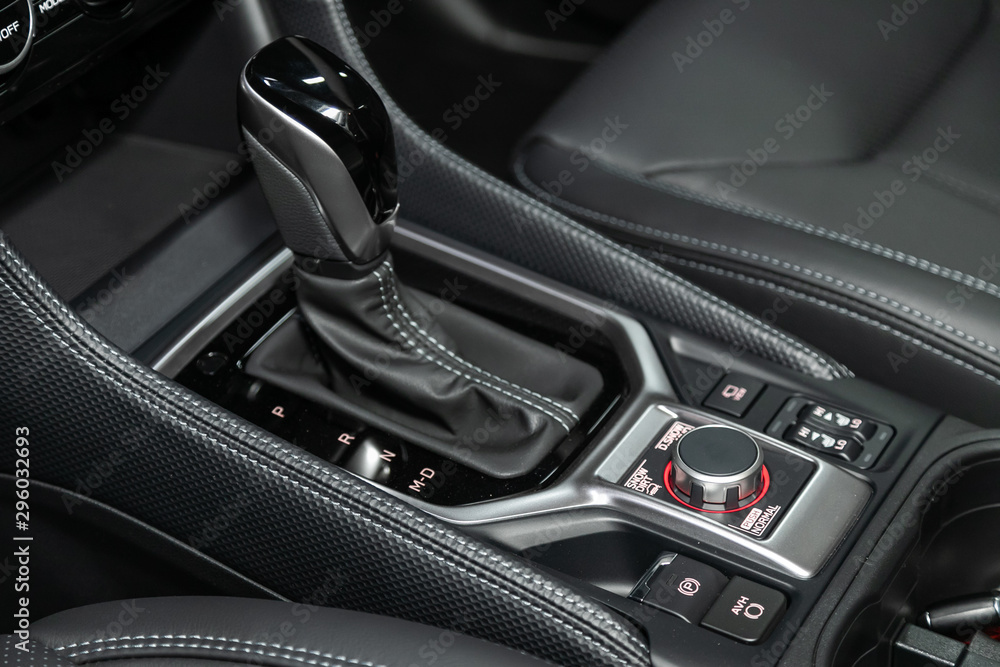 Poster close-up of the accelerator handle and buttons with modern central console with controls. automatic 
