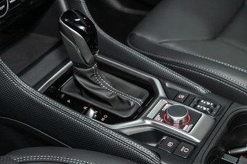 Plakat Close-up of the accelerator handle and buttons with modern central console with controls. automatic transmission gear of car , car interior.