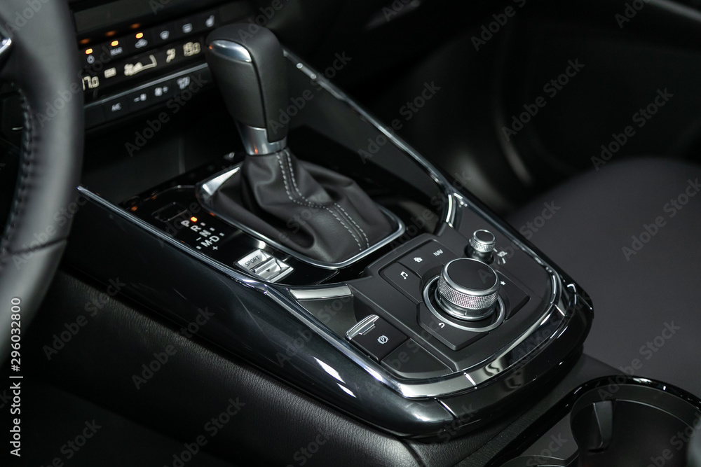 Poster close-up of the accelerator handle and buttons with modern central console with controls. automatic 