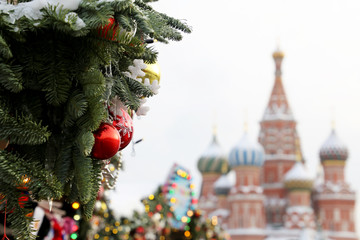 Christmas trees on Red Square in Moscow, New Year celebration in Russia. Christmas decorations on background of St. Basil's Cathedral, russian tourist landmark