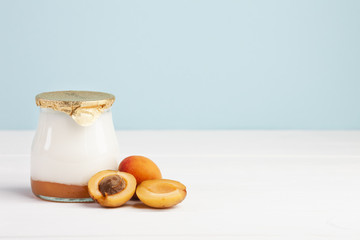 Jar of fresh milk and apricot fruit