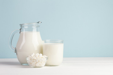 Milk jugs on blue background