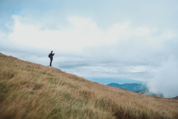 Obraz premium man on top of mountain in low tatras