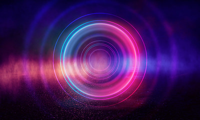 Neon circle on a dark street background, wet asphalt. Blue neon, smoke, smog. Night view of a street with neon. Abstract neon dark background.
