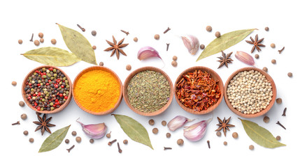 Bowls with different spices on white background