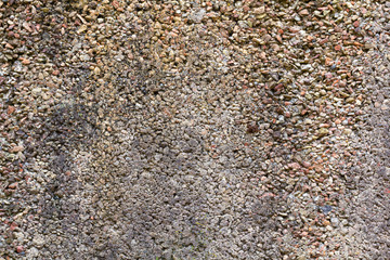 Strong surface structure of a gray cement wall.