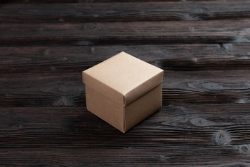 Cardboard box on a wooden background