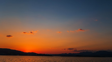 Natural Sunrise Sundown Over Sea Horizon island silhouette