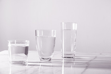 Glasses of fresh water on table