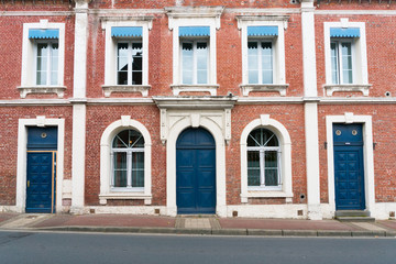 Fototapeta na wymiar typical Norman stone and brick house front with colorful contrasts