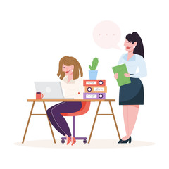 Young woman sitting at the desk and working on computer