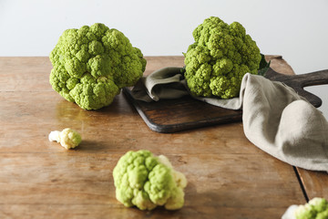 Tasty fresh cauliflower cabbage on wooden table