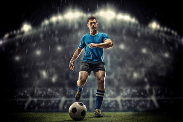 Soccer player in action on a dark background - 296042085