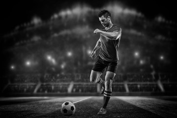 soccer or football player is kicking ball on stadium © romanolebedev