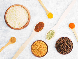Spices set and rice on concrete background. Modern apothecary, naturopathy and ayurveda concept.
