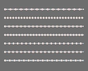 Set of pearl strings isolated on gray background.