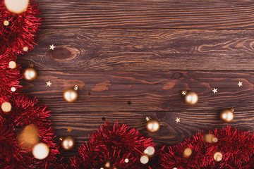 Obraz na płótnie Canvas Christmas or New Year decoration on wooden background with xmas tree and sparkle bokeh lights and stars. Merry Christmas card. Flat lay, copy space, top view. Space for text.