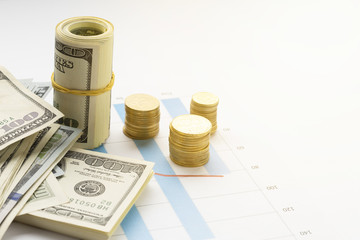 High angle view of currency on top of graph