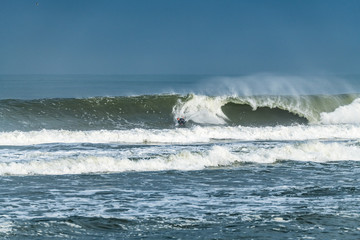 Bodyboarder surfing ocean wave