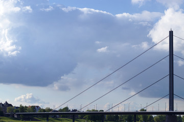 Fototapeta na wymiar Suspension bridge crossing the river rhine in dusseldorf, germany