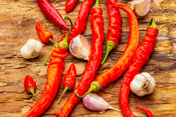 Red and orange chili pepper with garlic cooking food background