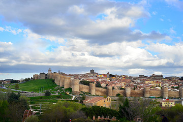 Fototapeta premium The wall of Ávila is a Romanesque military fence that surrounds the old town of the Spanish city of Ávila, capital of the homonymous province, in the autonomous community of Castilla y León.