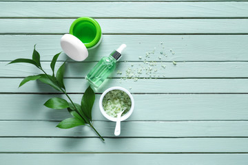 Composition with cosmetics for spa procedures on wooden background