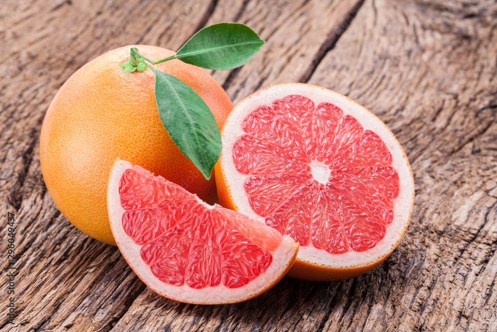 Sticker Grapefruits on old wooden background.