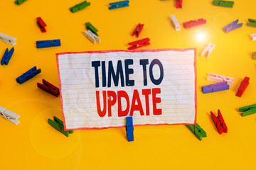 Conceptual hand writing showing Time To Update. Concept meaning act updating something someone or updated version program Colored clothespin papers empty reminder yellow floor office