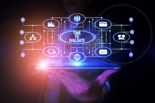 Word writing text Time To Evaluate. Business photo showcasing judge something with respect to its worth or significance Woman wear formal work suit presenting presentation using smart device