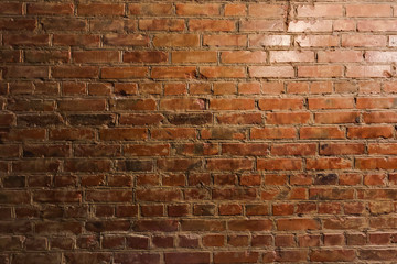 Old red brick wall. Faded red color, a bit dirty. Interior