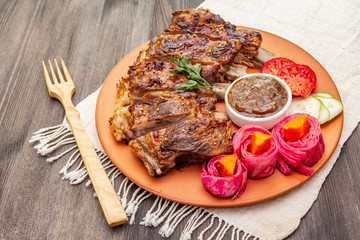 BBQ pork ribs with fermented, baked and fresh vegetables