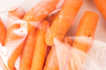 Bunch of organic Carrots wrapped in plastic