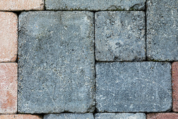 texture of gray and pink colored paving stones