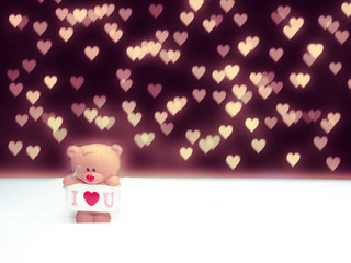 valentine's day composition of teddy bear and hearts