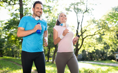 Happy couple running and exercising together outdoor