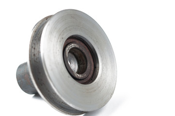 Small steel pulley isolated on white background.Copy space