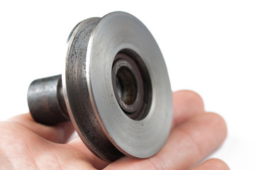 Small steel pulley isolated on white background.Copy space