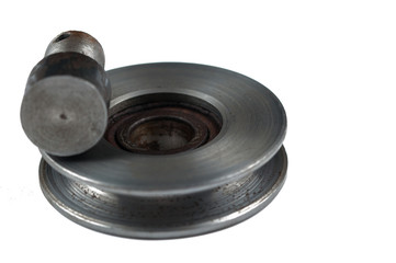Small steel pulley isolated on white background.Copy space